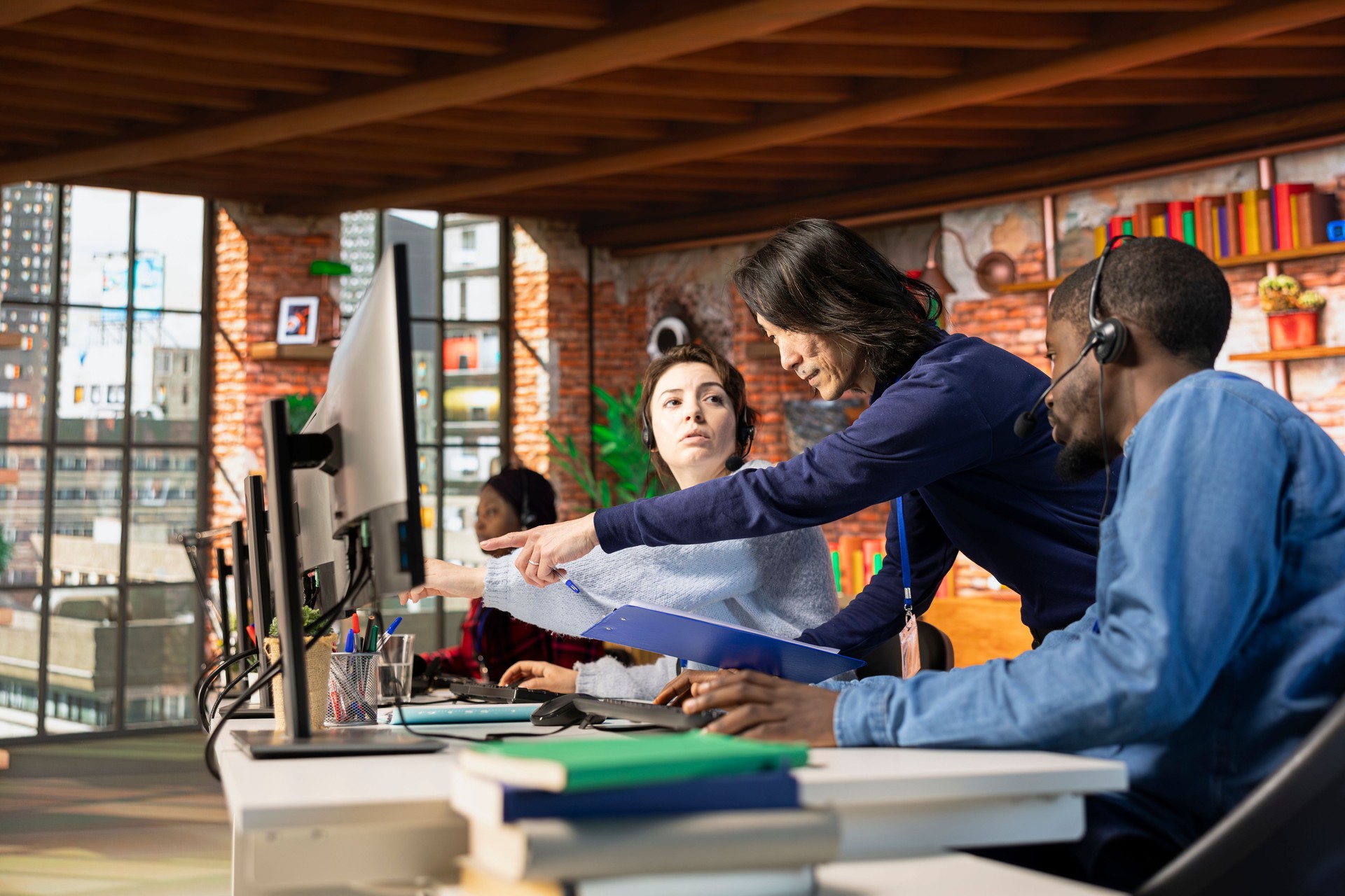 Call center manager evaluating multiethnic team performance