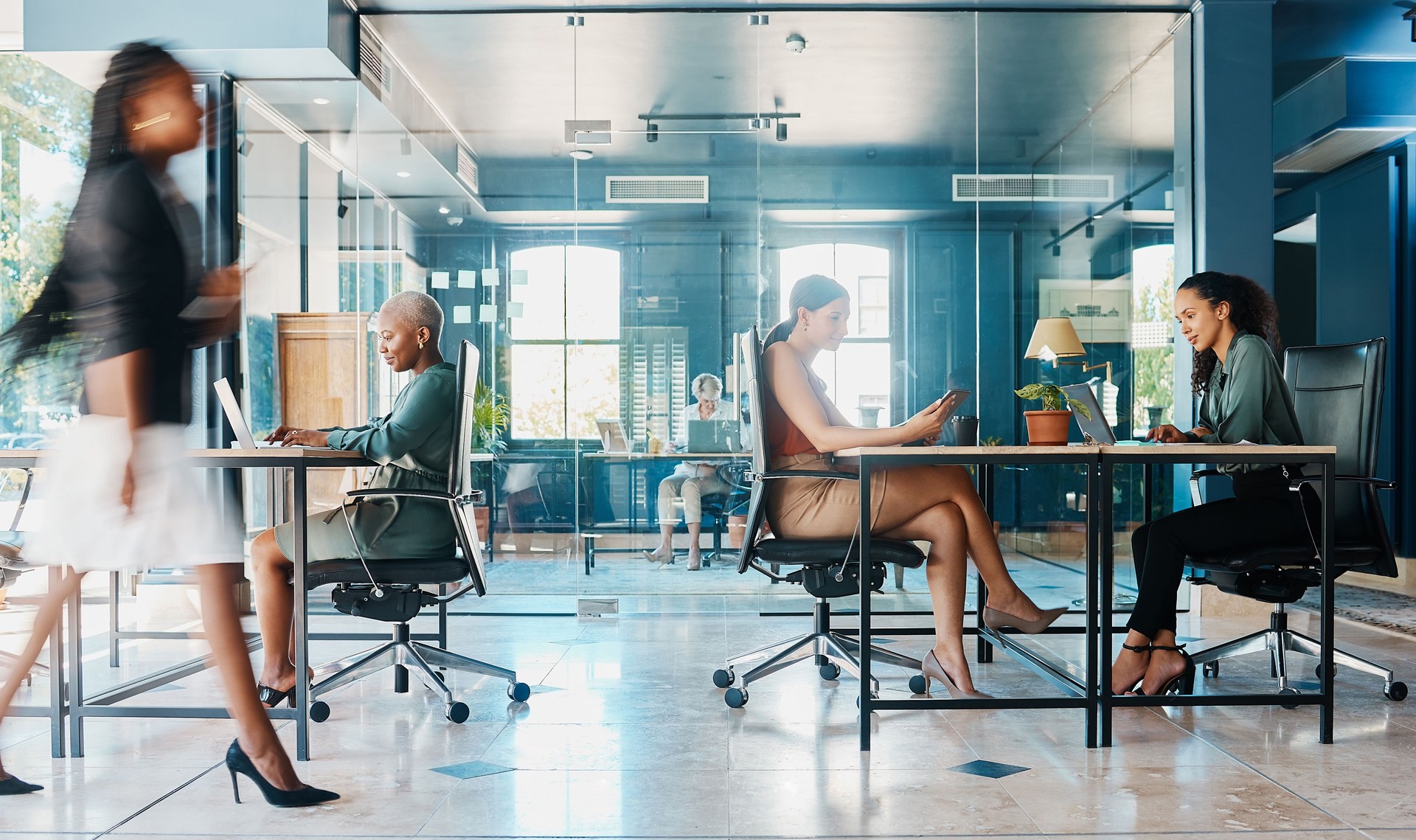 Full length shot of attractive and diverse businesswomen working in their corporate office